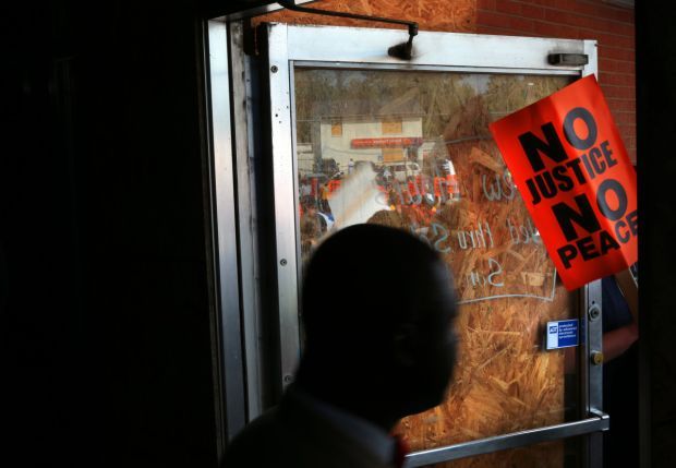 Business owners open doors, unsure when to remove boards
